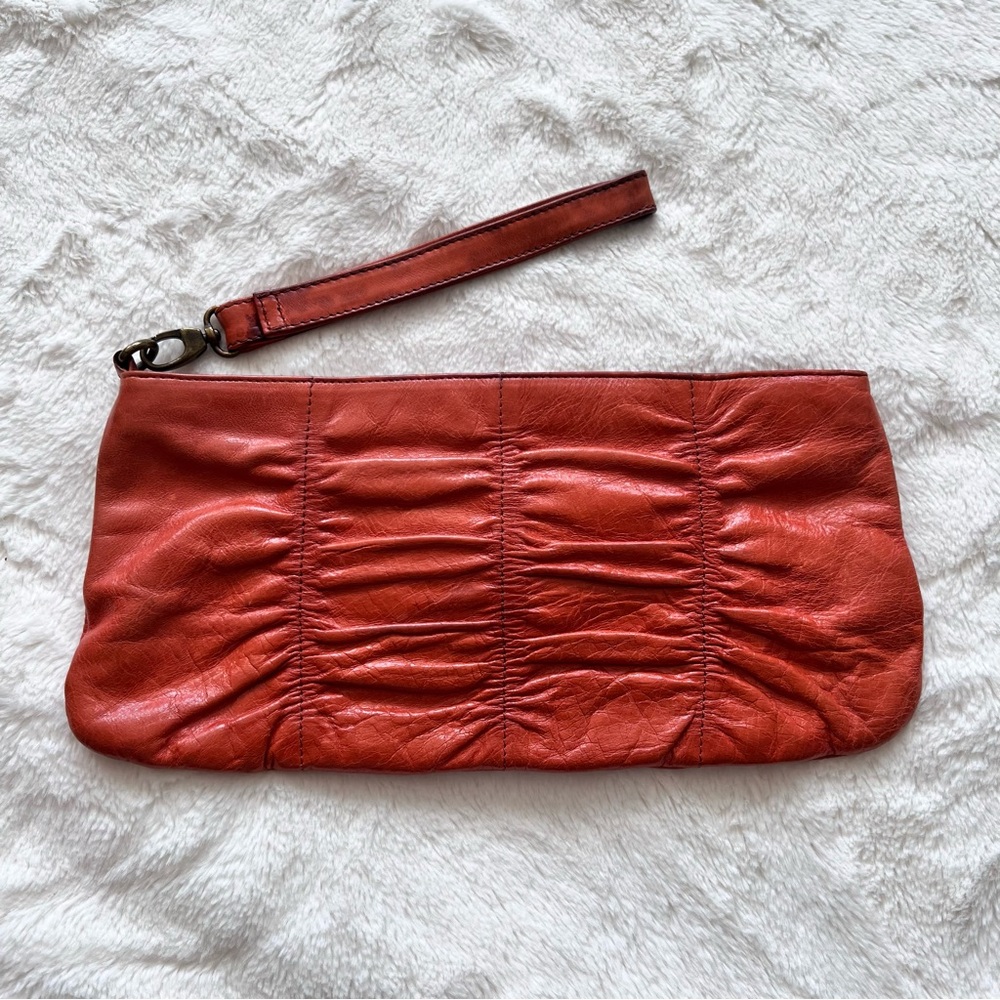 HOBO | deep orange leather clutch